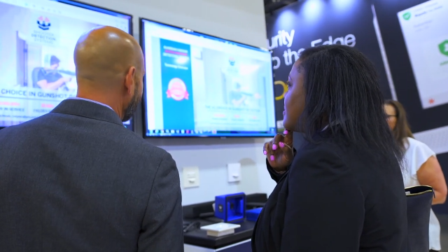 2022 SIA GovSummit attendees viewing a booth